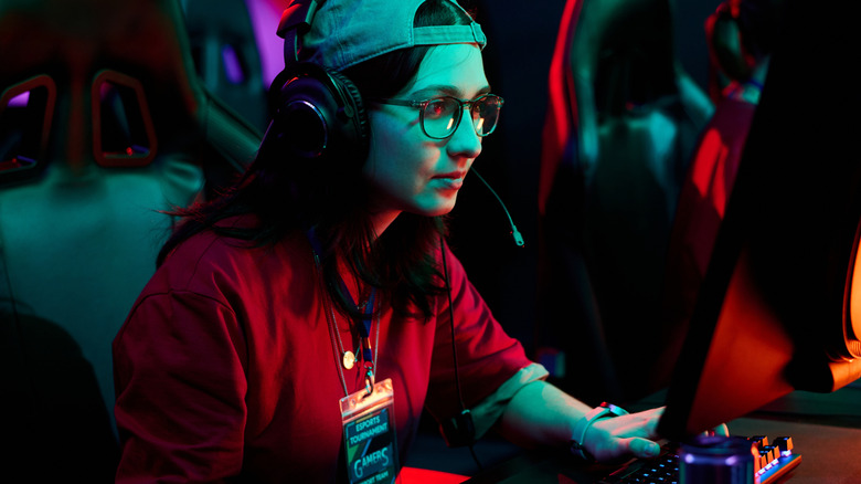 A young woman participating in an esports event