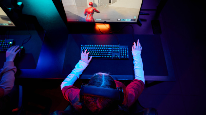 A young woman competing in an esports competition