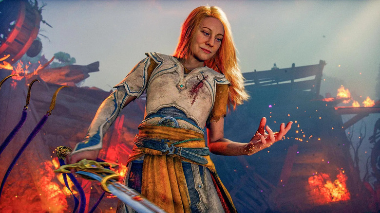 Faye glances at embers flowing between her fingers in God of War: Laufey