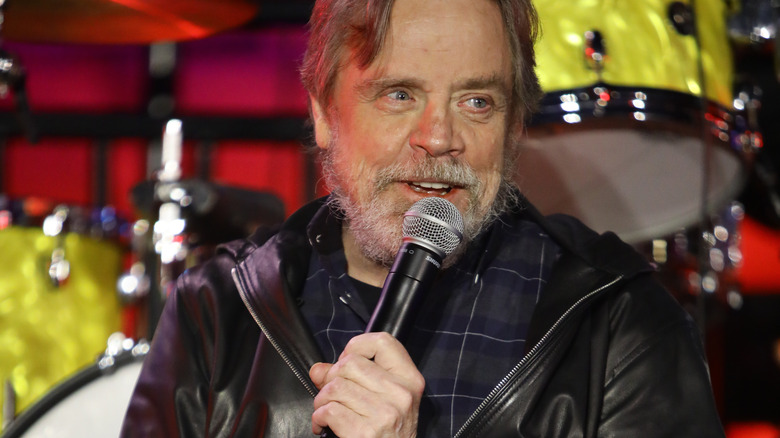 Mark Hamill speaking into mic