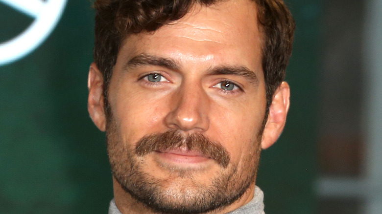 Henry Cavill with mustache smiling