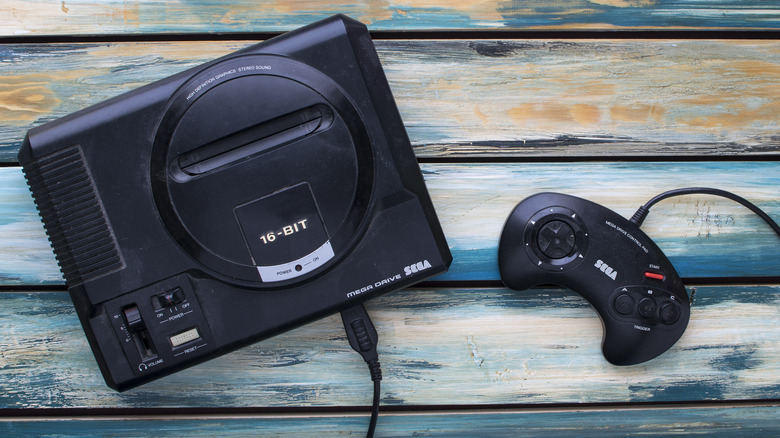 A Sega Genesis (or Mega Drive) on a table.