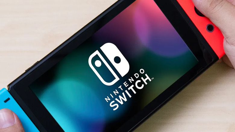 Man holding Nintendo Switch
