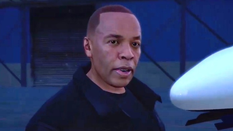 Dr. Dre in front of plane