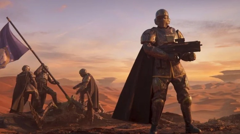 Helldivers raising a flag in "Helldivers 2"