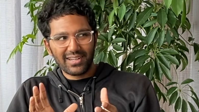 Vinit Agarwal talking and gesturing with his hands