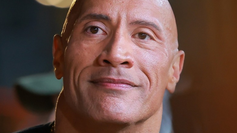 The Rock poses for a picture at a Black Adam expo in early October