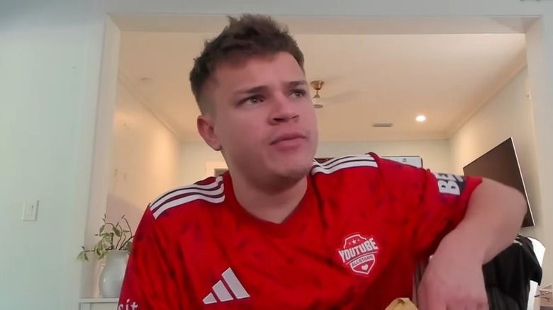 Jynxzi wearing red jersey
