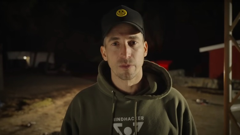 Max Major wearing cap with smiley face on it
