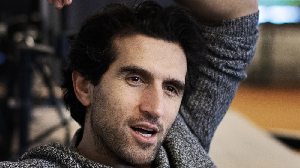 Josef Fares with arm raised