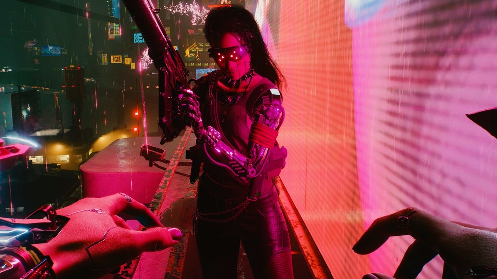 Female character brandishes gun in Cyberpunk 2077