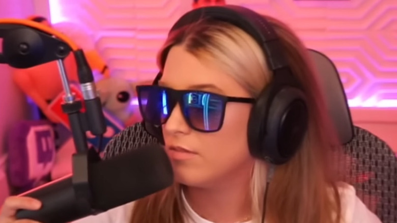 Tails talking into mic wearing mirrored sunglasses