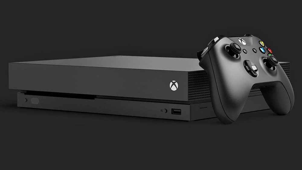 The Xbox One against a black backdrop
