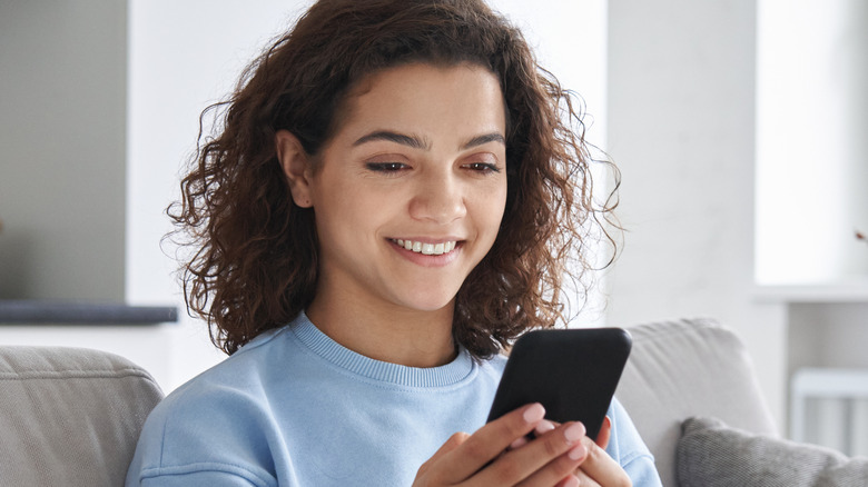 girl playing on phone