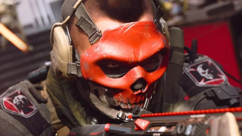 Operator wearing red skull mask
