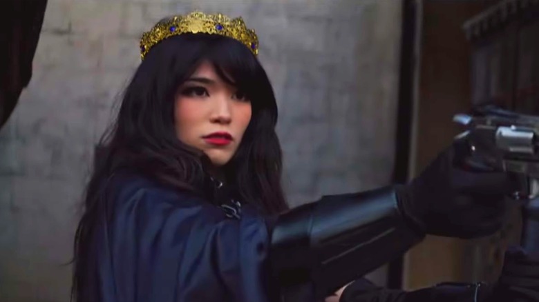 Emiru wearing crown and holding prop