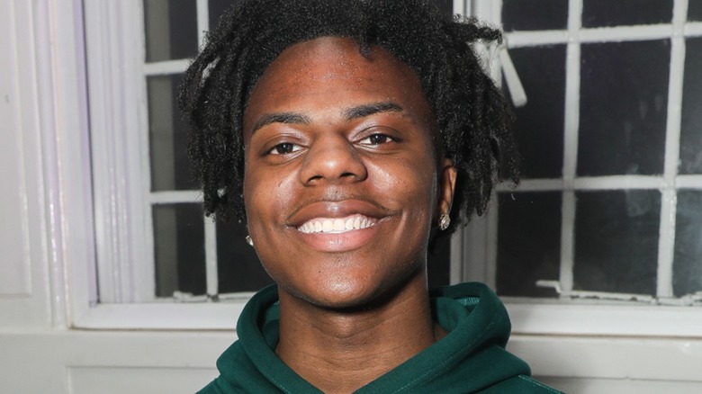 IShowSpeed wearing a green hoodie