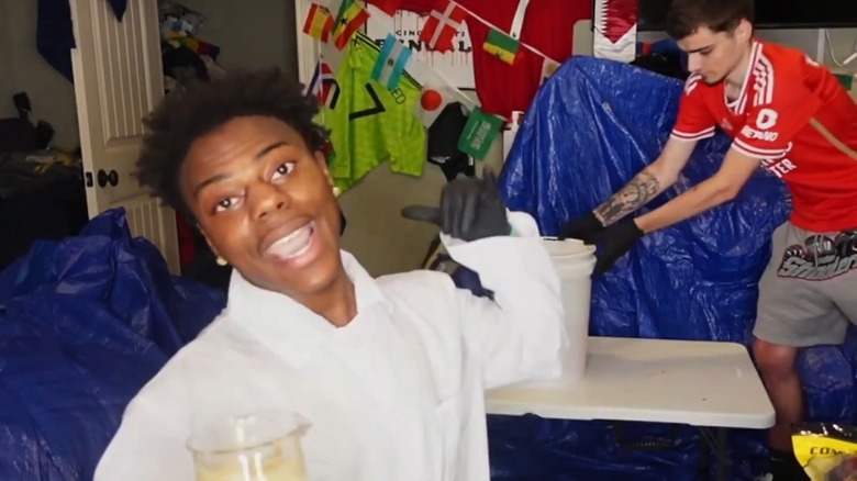 IShowSpeed wearing a lab jacket before a chemistry experiment