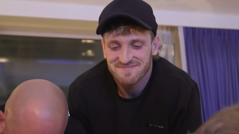 Logan Paul watching his fake Pokemon box