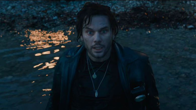 James Sunderland reacts in shock on a lake in Return to Silent Hill