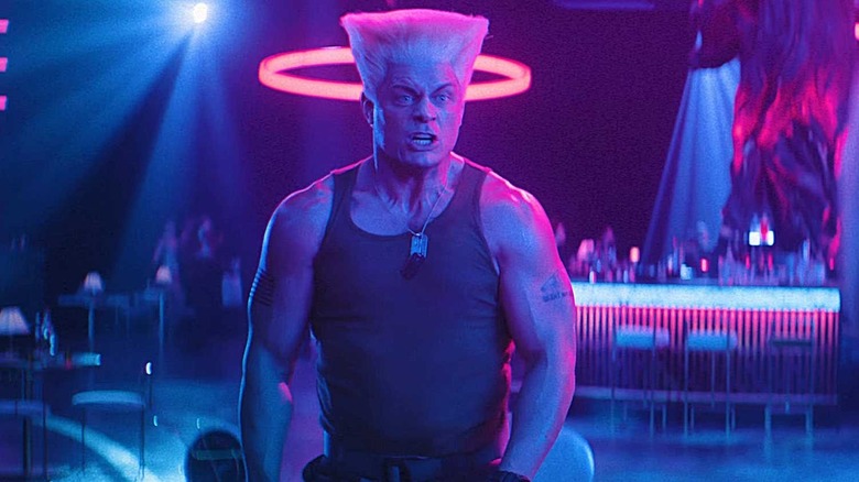 Guile stands in a neon-lit nightclub in Street Fighter (2026)