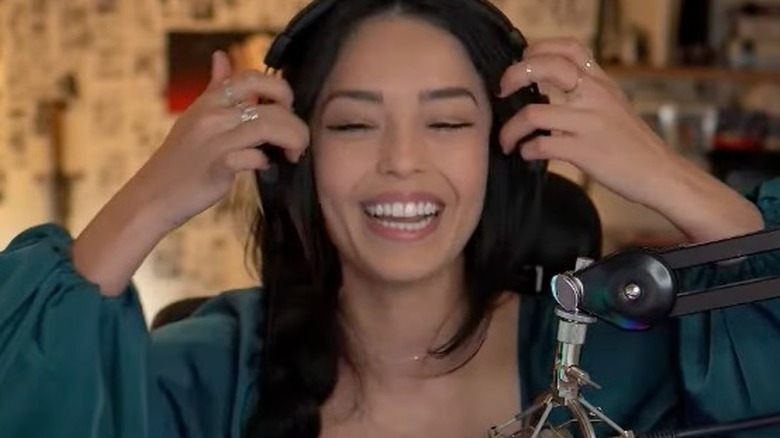 Valkyrae adjusting headphones