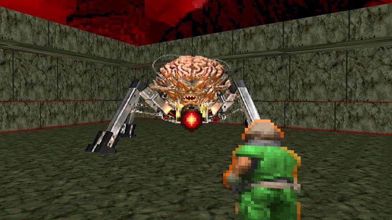 Doom Guy firing at the Spiderdemon in Doom (1993)
