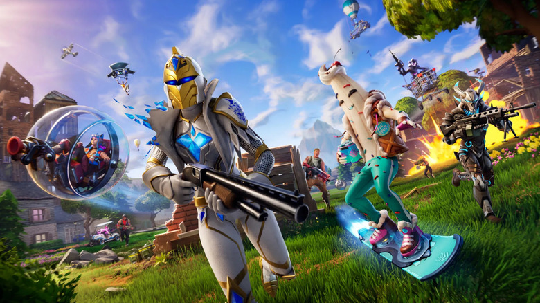 Players in a variety of skins holding different weapons charge across a grassy field in Fortnite