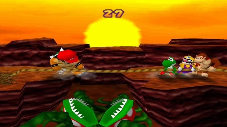Mario engages in a tug-of-war game with Yoshi, Wario, and Donkey Kong over a ravine in Mario Party