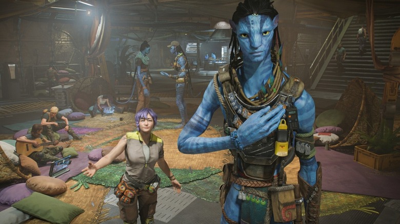 A human and Na'vi pose for a photo in "Avatar: Frontiers of Pandora" (2024)