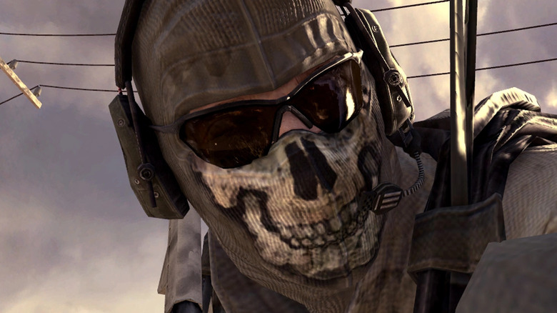 Operator wearing skull mask and headphones