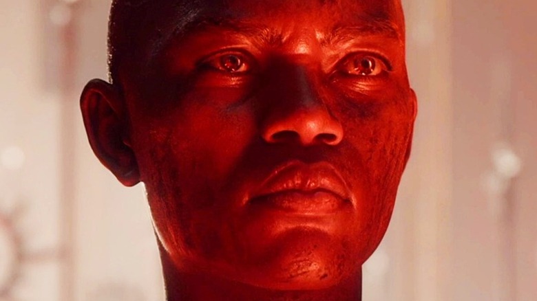 Character stares in red light