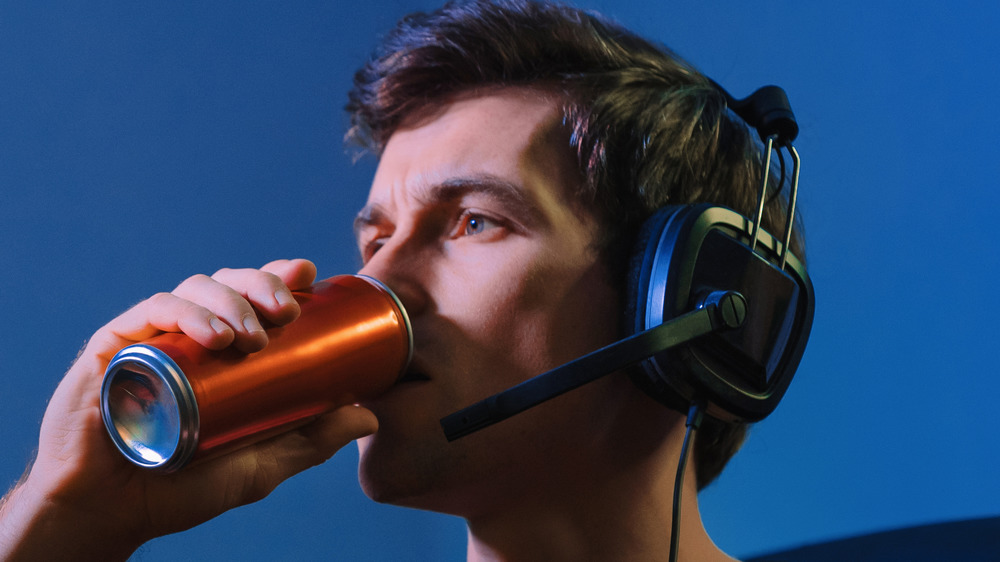 Gamer drinking energy drink.