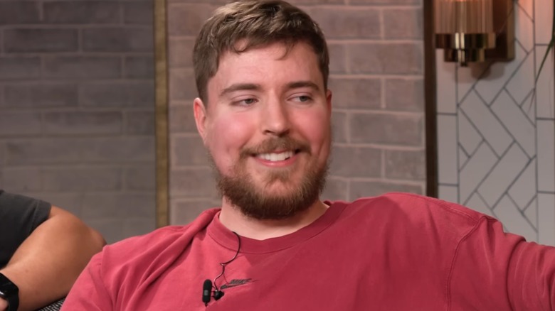 MrBeast smiling on a couch