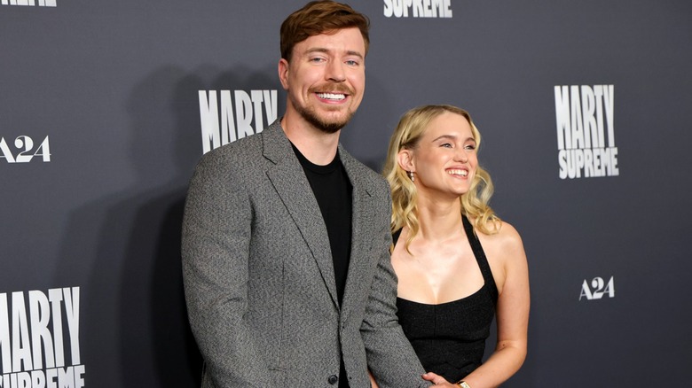 MrBeast and Thea Booysen smiling for photos