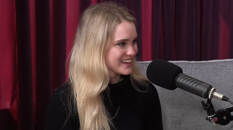 Thea Booysen talking into a microphone