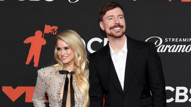 Thea Booysen and MrBeast posing for press photos