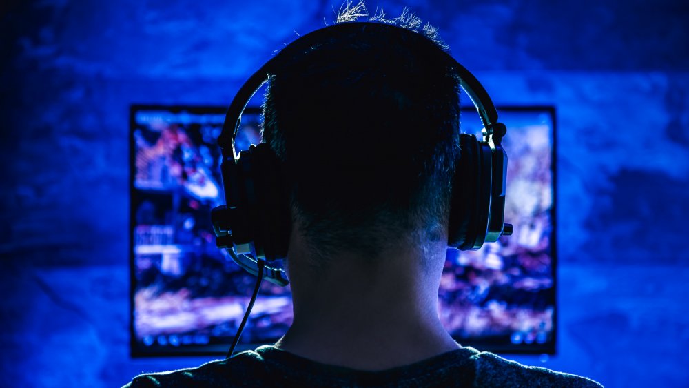 guy playing games wearing headphones