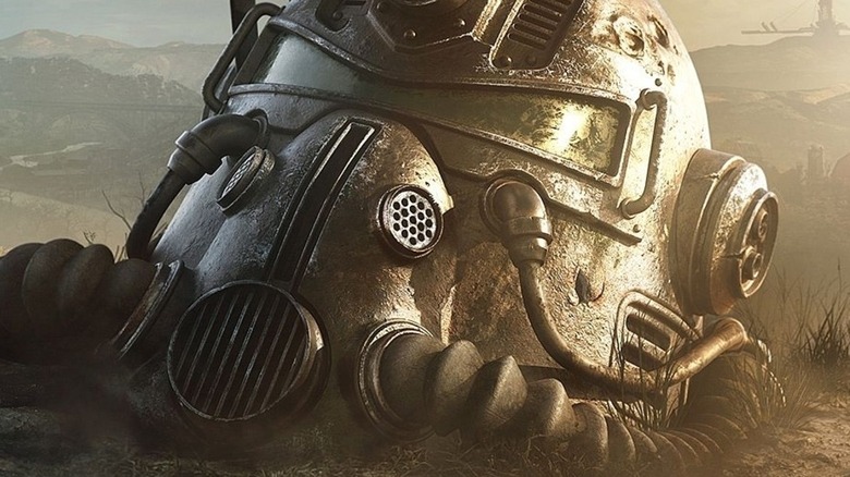 Power armor helmet lying in the dirt