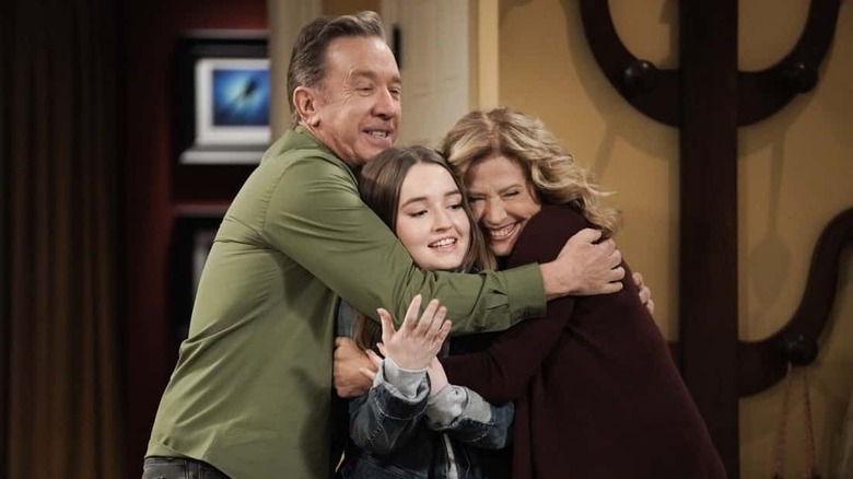 Vanessa and Mike hugging Eve