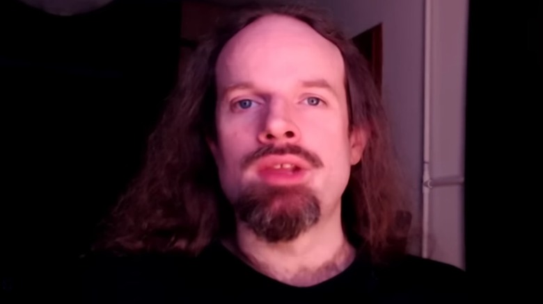 Accursed Farms talking into the camera