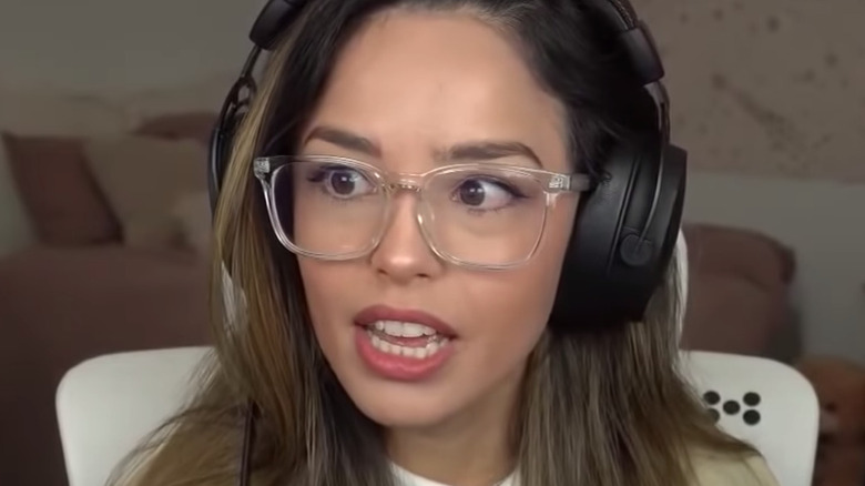 Valkyrae wearing glasses and headset