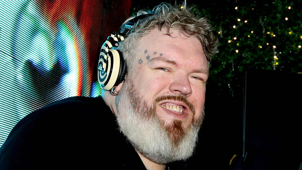 Kristian Nairn wearing headphones