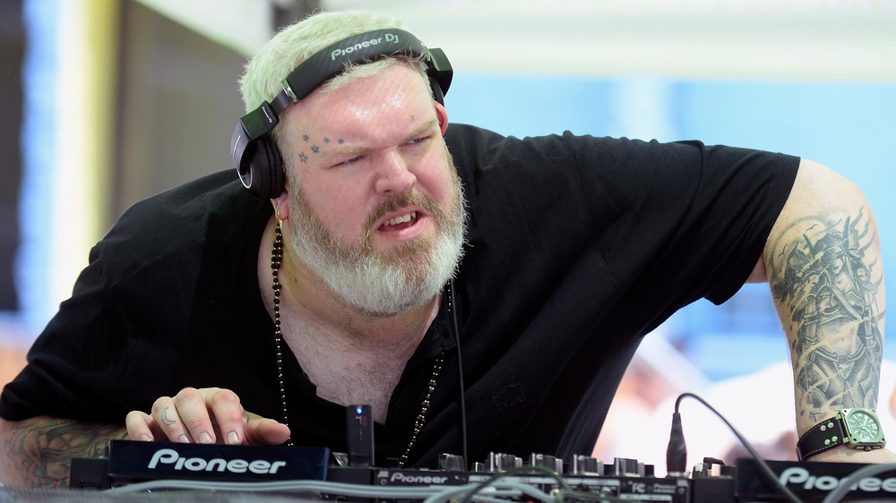 Kristian Nairn bent over turntables