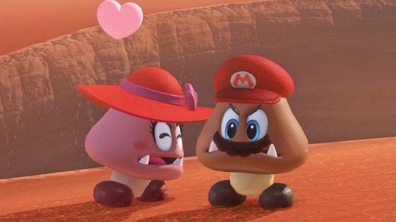 A female Goomba looking at a Goomba wearing Cappy