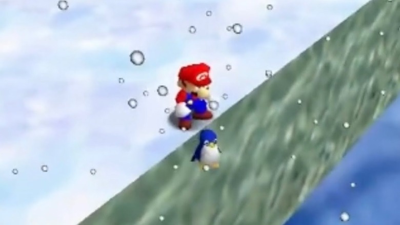 Mario standing over a falling baby penguin