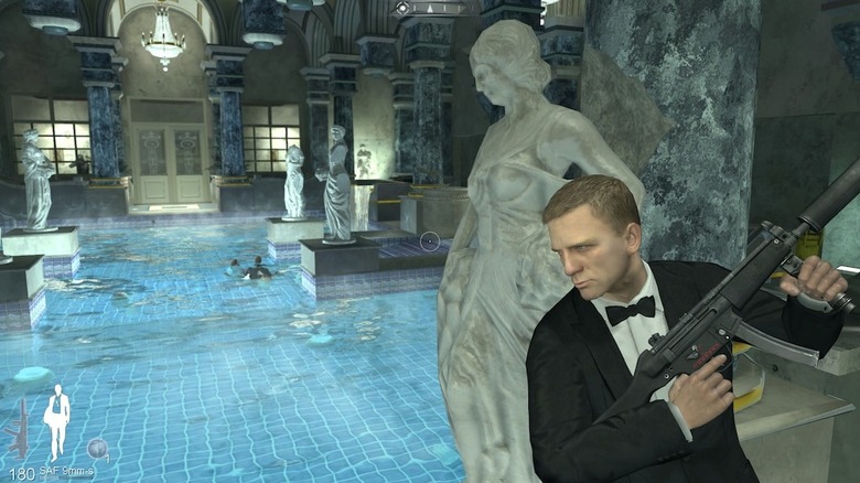 James Bond takes cover behind a statue at a swimming pool in 007: Quantum of Solace