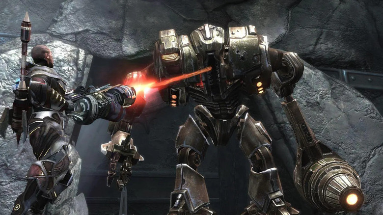 Baldur fires a laser at a large mech in Too Human