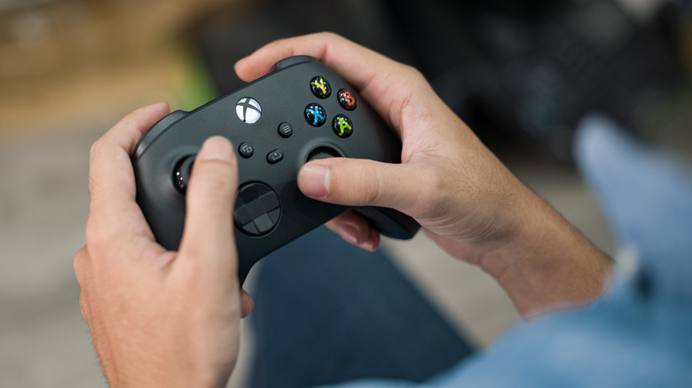 Gamer holding Xbox controller