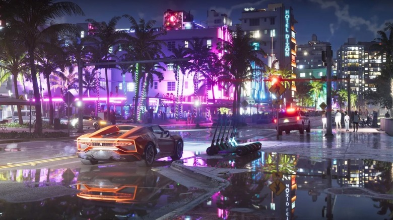 A nighttime look at Vice City with some lit-up sports cars